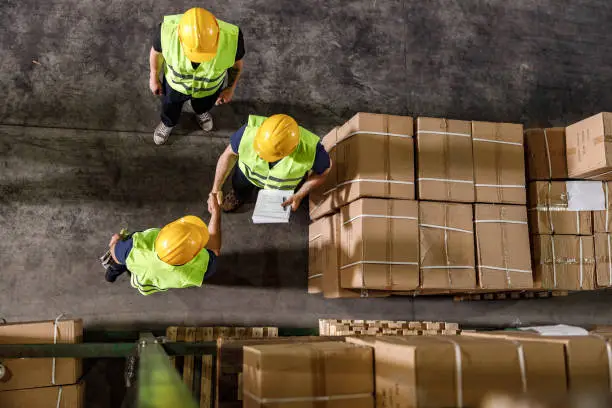 GM Logistics team reviewing freight in the warehouse