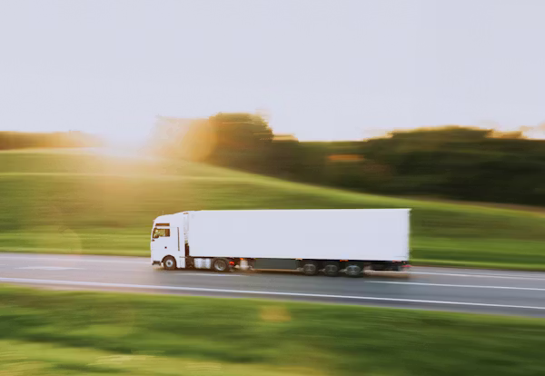 Linehaul truck on an open Australian highway at sunset